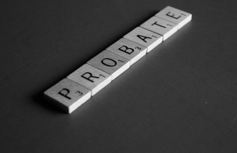 Probate illustration image The word "PROBATE" spelled out using letter tiles on a dark background.
