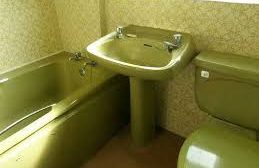 A house that needs updating illustration image Vintage bathroom setting featuring a green sink, toilet, and bathtub.