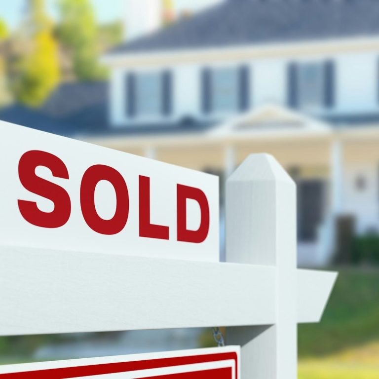 This is a for sale board, that is marked as sold, outside a house in Ascot, Berkshire.